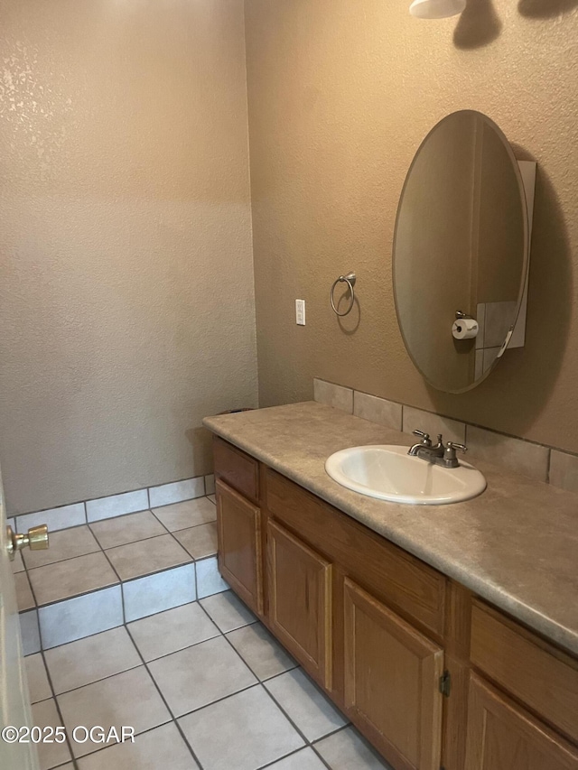 1701 S Kenser Rd, Joplin, MO 64801 - bathroom featuring vanity, tile patterned floors, and a textured wall