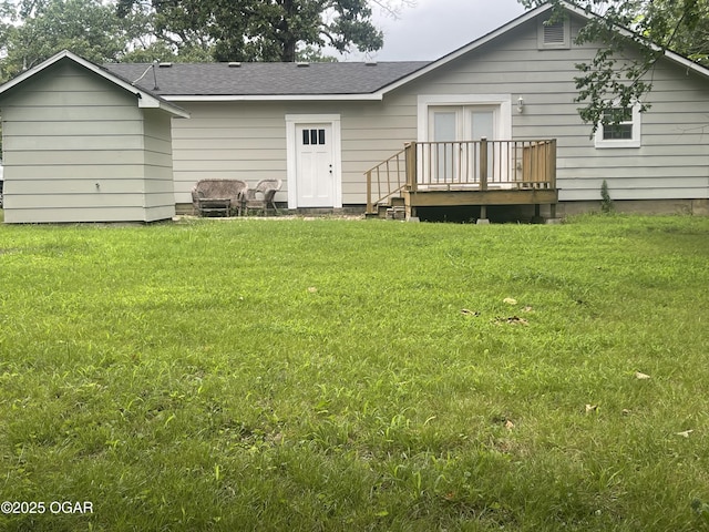 1701 S Kenser Rd, Joplin, MO 64801 - rear view of property with a deck, a yard, and a shingled roof