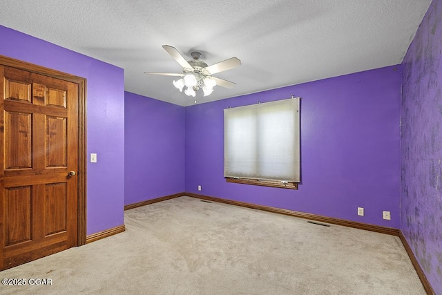 4345 Rob Ln, Joplin, MO 64804 - carpeted empty room with ceiling fan and a textured ceiling