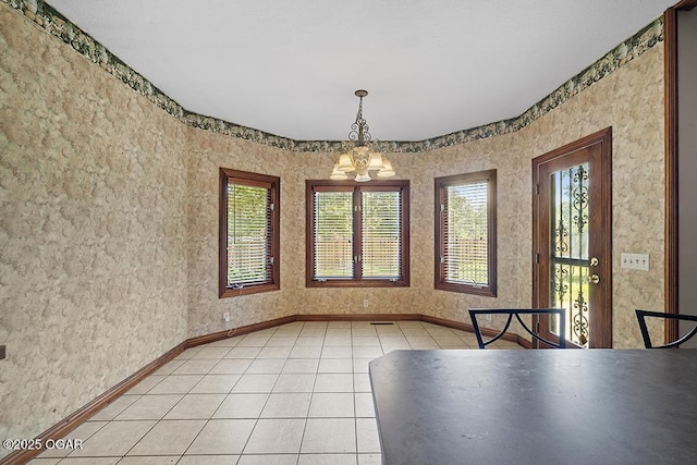 4345 Rob Ln, Joplin, MO 64804 - unfurnished dining area with a chandelier and light tile patterned floors