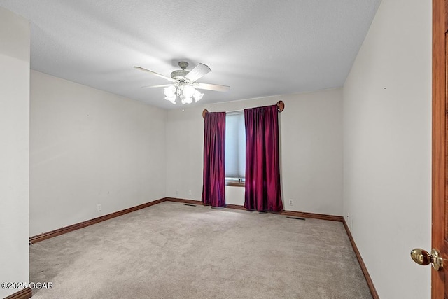 4345 Rob Ln, Joplin, MO 64804 - spare room featuring carpet floors, ceiling fan, and a textured ceiling
