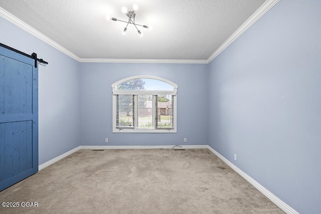 4345 Rob Ln, Joplin, MO 64804 - carpeted spare room with a textured ceiling, a barn door, and crown molding