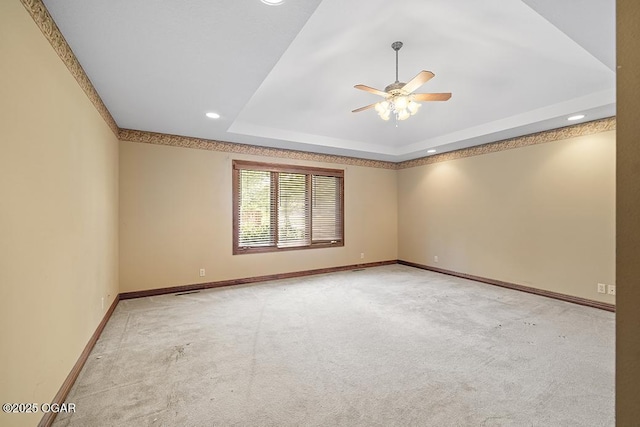 4345 Rob Ln, Joplin, MO 64804 - spare room with a ceiling fan, carpet flooring, a tray ceiling, and recessed lighting
