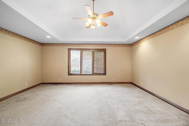 4345 Rob Ln, Joplin, MO 64804 - carpeted spare room with a tray ceiling, recessed lighting, and a ceiling fan