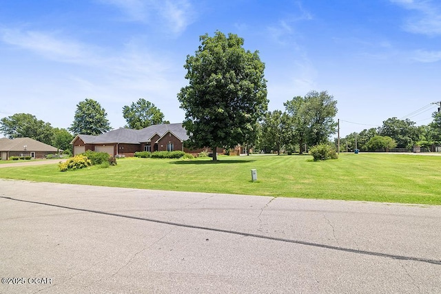 4345 Rob Ln, Joplin, MO 64804 - view of front facade with an attached garage and a front lawn