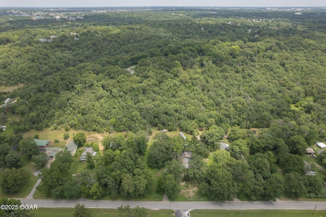 1021 Glendale Rd, Joplin, MO 64804 - aerial view of property and surrounding area featuring a heavily wooded area