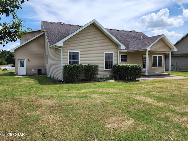 1502 E 7th St, Lamar, MO 64759 - rear view of house with roof with shingles and a lawn