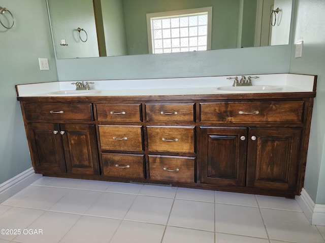 1502 E 7th St, Lamar, MO 64759 - bathroom with double vanity and tile patterned flooring