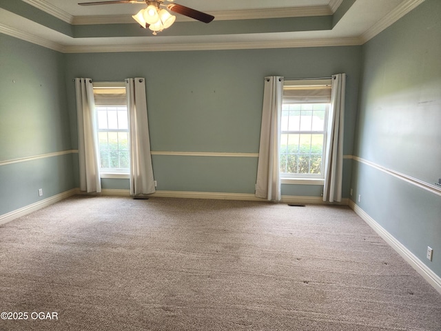 1502 E 7th St, Lamar, MO 64759 - empty room with a raised ceiling, carpet floors, ornamental molding, and a ceiling fan