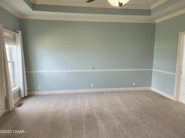 1502 E 7th St, Lamar, MO 64759 - carpeted empty room with a raised ceiling, crown molding, and a ceiling fan