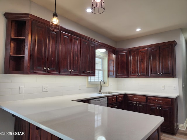 1502 E 7th St, Lamar, MO 64759 - kitchen with open shelves, dark brown cabinets, a peninsula, light countertops, and recessed lighting