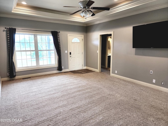 1502 E 7th St, Lamar, MO 64759 - entrance foyer featuring ornamental molding, a raised ceiling, carpet flooring, and ceiling fan