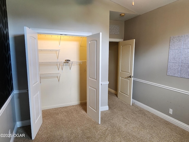 1502 E 7th St, Lamar, MO 64759 - unfurnished bedroom featuring carpet flooring, a closet, and lofted ceiling