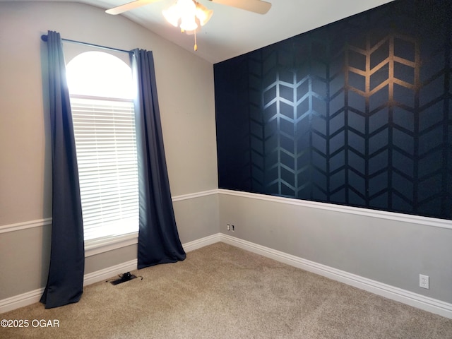 1502 E 7th St, Lamar, MO 64759 - carpeted empty room with ceiling fan, healthy amount of natural light, and lofted ceiling
