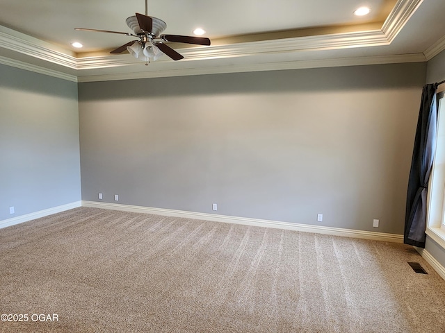 1502 E 7th St, Lamar, MO 64759 - carpeted spare room featuring crown molding, a raised ceiling, a ceiling fan, and recessed lighting