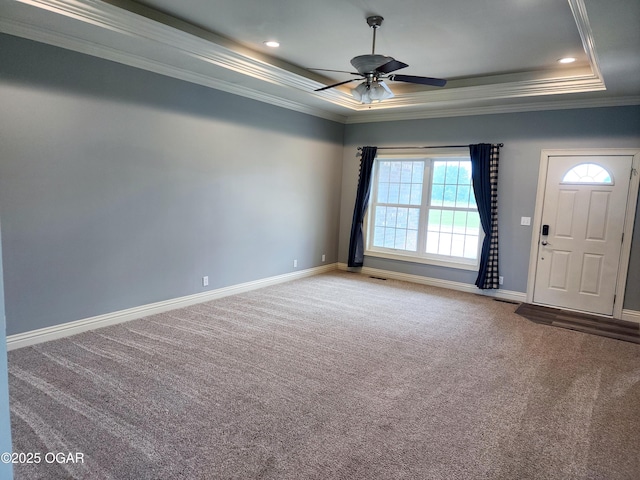 1502 E 7th St, Lamar, MO 64759 - carpeted empty room featuring a tray ceiling, crown molding, and a ceiling fan