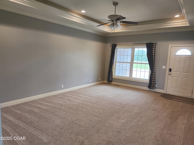 1502 E 7th St, Lamar, MO 64759 - spare room featuring a tray ceiling, carpet floors, ornamental molding, ceiling fan, and recessed lighting