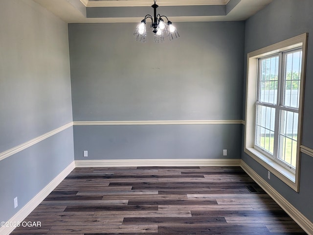 1502 E 7th St, Lamar, MO 64759 - unfurnished room with a chandelier, dark wood finished floors, crown molding, and a tray ceiling