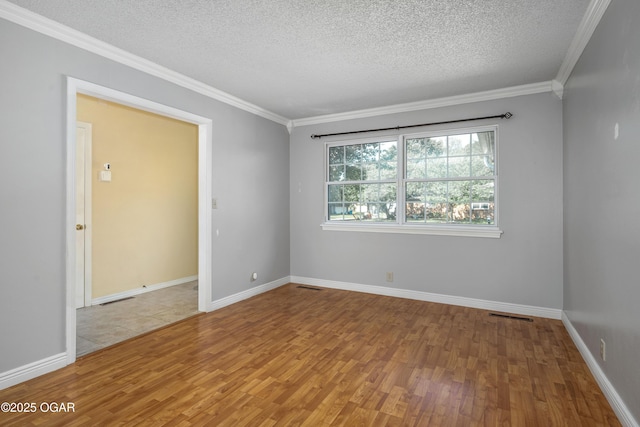 3701 College View Dr, Joplin, MO 64801 - unfurnished room with wood finished floors, a textured ceiling, and ornamental molding