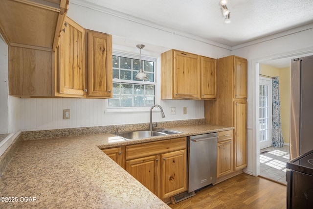 3701 College View Dr, Joplin, MO 64801 - kitchen featuring appliances with stainless steel finishes, wood finished floors, hanging light fixtures, and light countertops