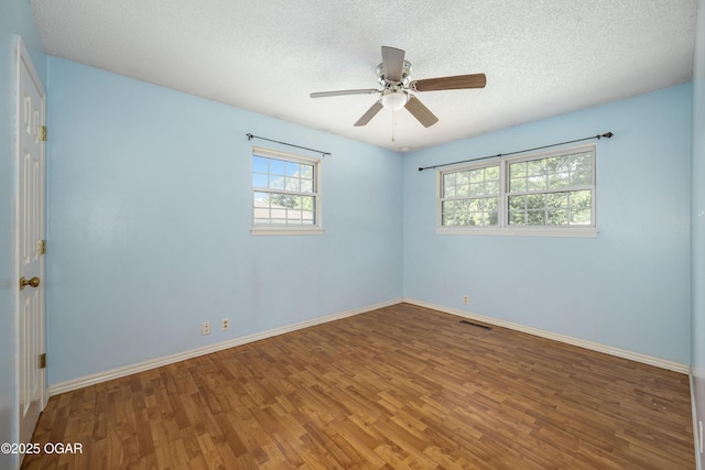 3701 College View Dr, Joplin, MO 64801 - unfurnished room with wood finished floors, a textured ceiling, and a ceiling fan