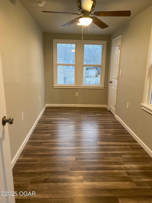 801 S Picher Ave, Joplin, MO 64801 - unfurnished room featuring ceiling fan and dark wood-style floors