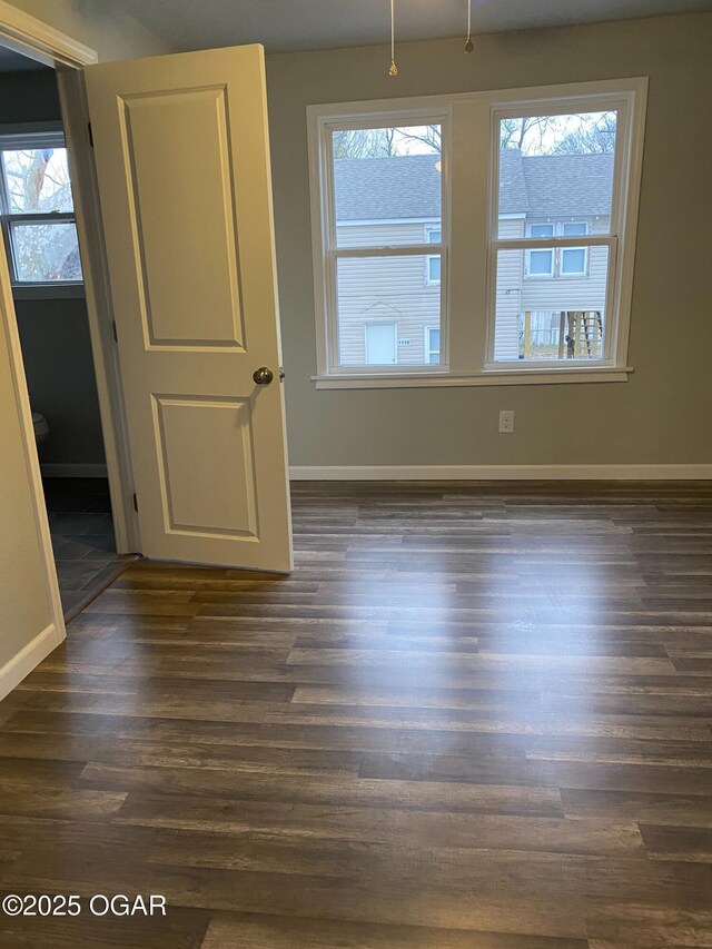 801 S Picher Ave, Joplin, MO 64801 - unfurnished room with dark wood-style flooring and baseboards