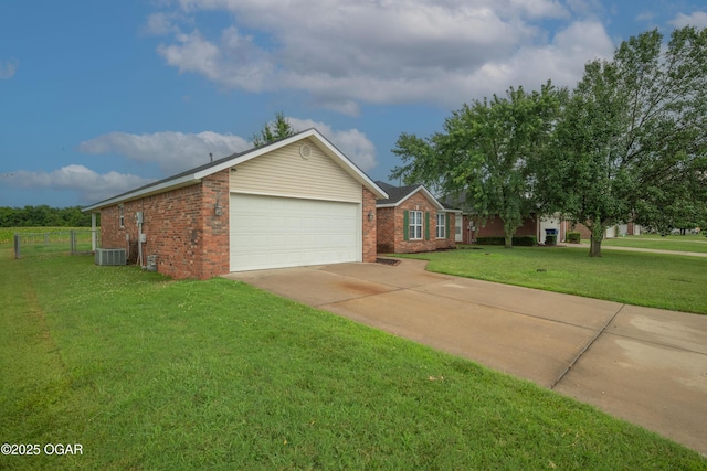 2238 Holly Ln, Miami, OK 74354 - ranch-style house featuring brick siding, an attached garage, and concrete driveway