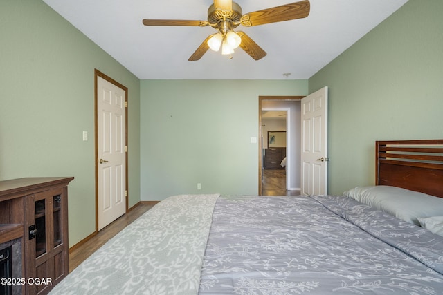 2238 Holly Ln, Miami, OK 74354 - bedroom with wood finished floors and ceiling fan