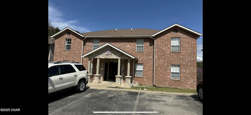 2962 Vineyards Pkwy Unit 1, Branson, MO 65616 - view of property with uncovered parking and brick siding