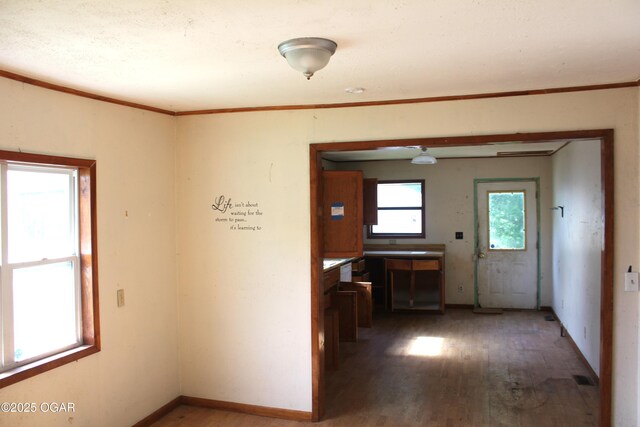 2414 W 4th St, Joplin, MO 64801 - corridor featuring wood finished floors and ornamental molding