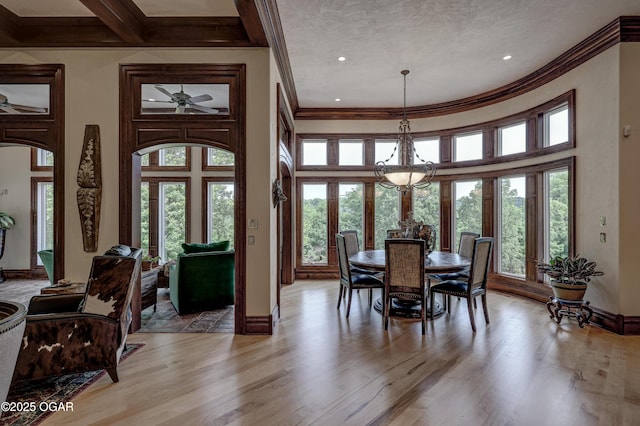 1126 Carrington Ter, Joplin, MO 64804 - dining room featuring crown molding, a towering ceiling, light wood finished floors, a chandelier, and recessed lighting