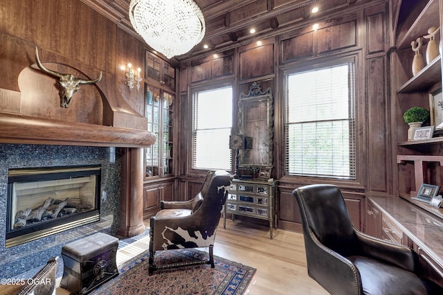 1126 Carrington Ter, Joplin, MO 64804 - office with a chandelier, wood walls, crown molding, a high end fireplace, and light wood-type flooring