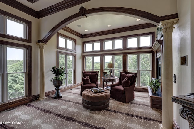 1126 Carrington Ter, Joplin, MO 64804 - sitting room featuring ornate columns, carpet floors, crown molding, a high ceiling, and arched walkways