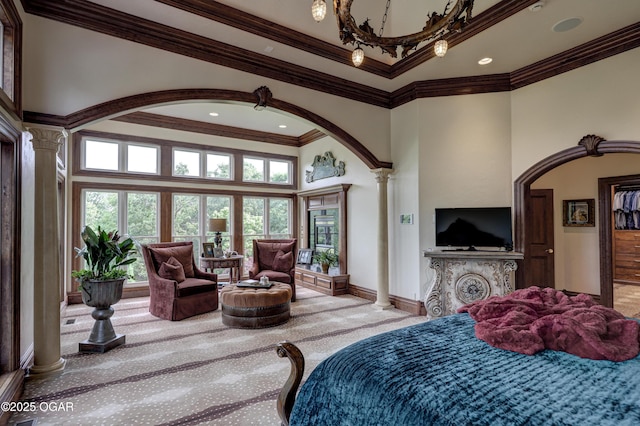 1126 Carrington Ter, Joplin, MO 64804 - bedroom featuring decorative columns, carpet flooring, a towering ceiling, multiple windows, and arched walkways