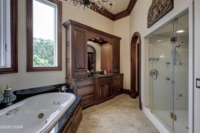 1126 Carrington Ter, Joplin, MO 64804 - bathroom featuring a stall shower, crown molding, vanity, a tub with jets, and a chandelier