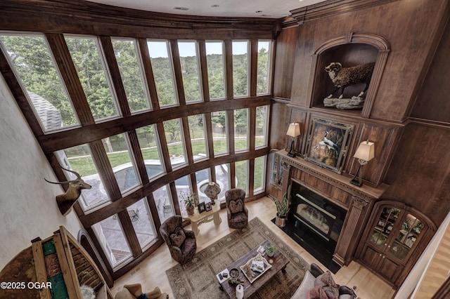 1126 Carrington Ter, Joplin, MO 64804 - living room featuring a towering ceiling, light wood-style flooring, and a high end fireplace