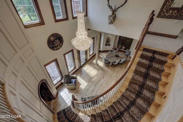 1126 Carrington Ter, Joplin, MO 64804 - living room featuring light wood-style flooring and a towering ceiling