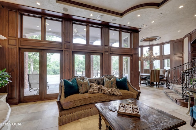 1126 Carrington Ter, Joplin, MO 64804 - living room featuring light tile patterned flooring, ornamental molding, recessed lighting, a towering ceiling, and stairs