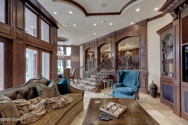 1126 Carrington Ter, Joplin, MO 64804 - living area featuring a chandelier, ornamental molding, arched walkways, recessed lighting, and stairway