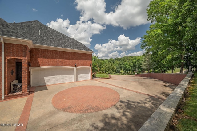 1126 Carrington Ter, Joplin, MO 64804 - view of patio featuring curved driveway
