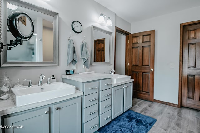 2005 Laura Ln, Joplin, MO 64801 - full bathroom with two vanities and wood finished floors
