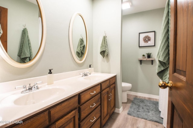 2005 Laura Ln, Joplin, MO 64801 - bathroom featuring double vanity and wood finished floors