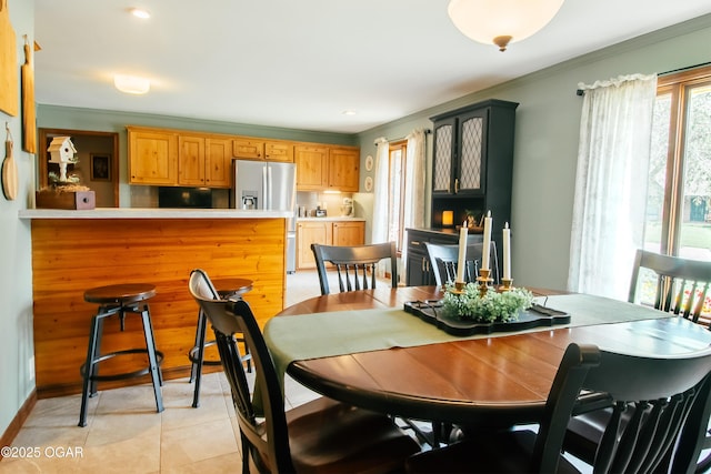 2005 Laura Ln, Joplin, MO 64801 - dining space featuring light tile patterned floors and crown molding