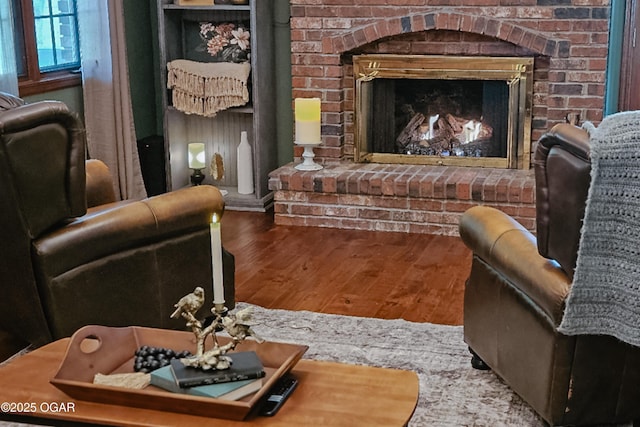 2005 Laura Ln, Joplin, MO 64801 - living area featuring wood finished floors and a brick fireplace