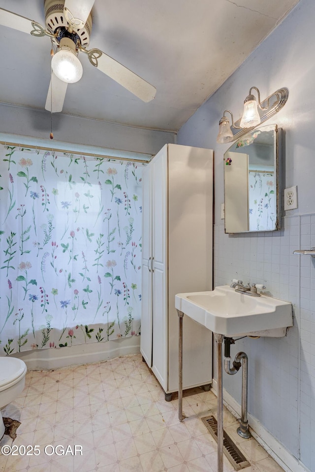 1123 Garden Grove Rd, Joplin, MO 64801 - full bath with shower / tub combo, tile patterned floors, and a ceiling fan