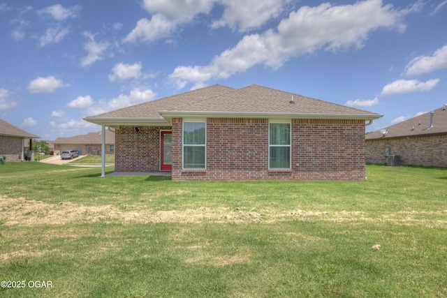 2008 Greydon Ln, Webb City, MO 64870 - back of house with a yard and brick siding