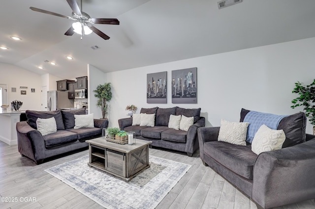 2008 Greydon Ln, Webb City, MO 64870 - living area featuring light wood-style flooring, vaulted ceiling, and ceiling fan