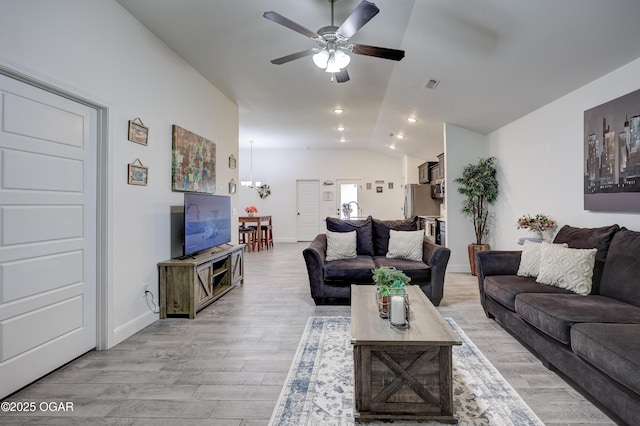 2008 Greydon Ln, Webb City, MO 64870 - living room featuring vaulted ceiling, ceiling fan, light wood finished floors, a chandelier, and recessed lighting