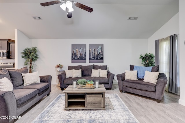 2008 Greydon Ln, Webb City, MO 64870 - living room with vaulted ceiling, a ceiling fan, and light wood-style floors